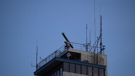 control tower with rotating radar and antennas at sea port