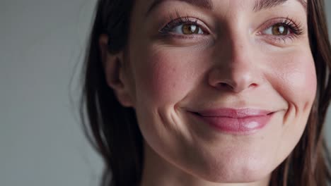 close-up video frame of a smiling woman, showcasing natural beauty video