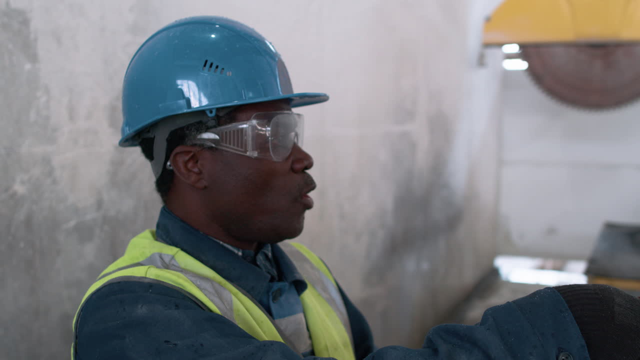 Man cleaning marble piece
