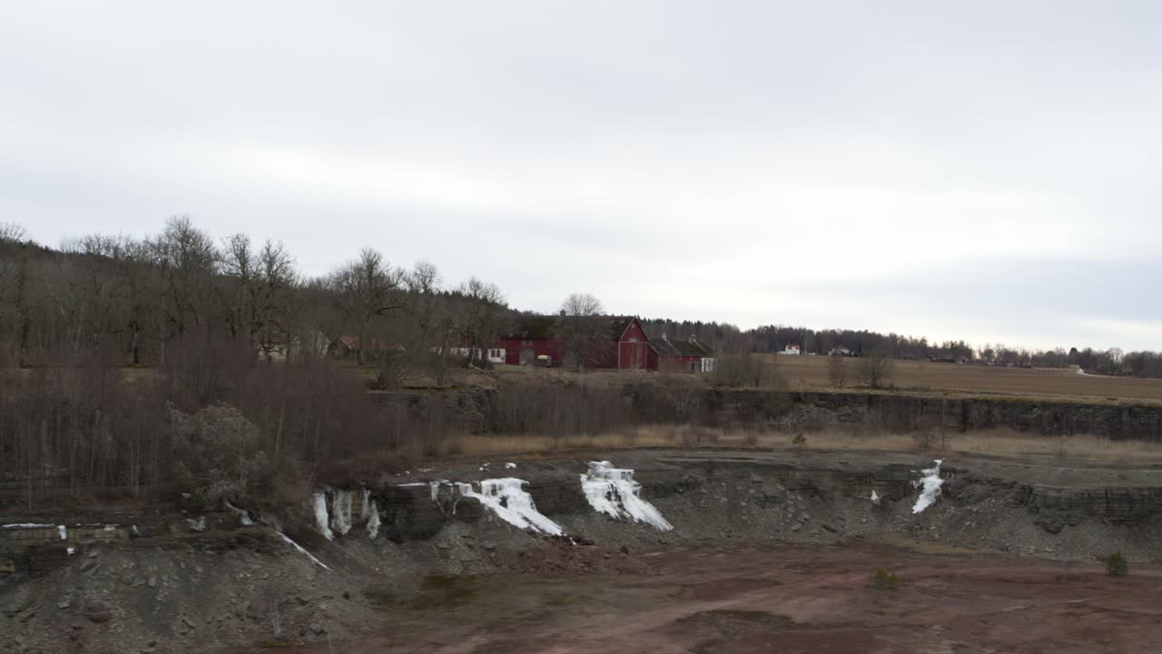Pan sideway Aerial view drone flight over lake in Kinnekulle Sweden