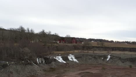 pan sideway aerial view drone flight over lake in kinnekulle sweden