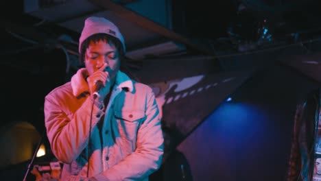 atlanta, ga - december 15, 2018: a rising star in the southeastern rap scene, boregard, performs in a hip-hop duo at a lively concert in an underground urban nightclub popular with millennials.