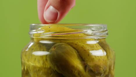 pickled cucumbers in a jar