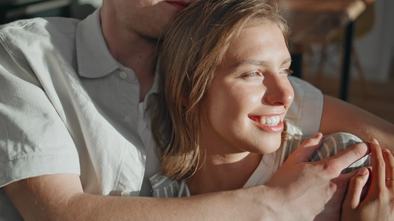 Gentle couple bonding home closeup. Affectionate lovers talking lying on couch