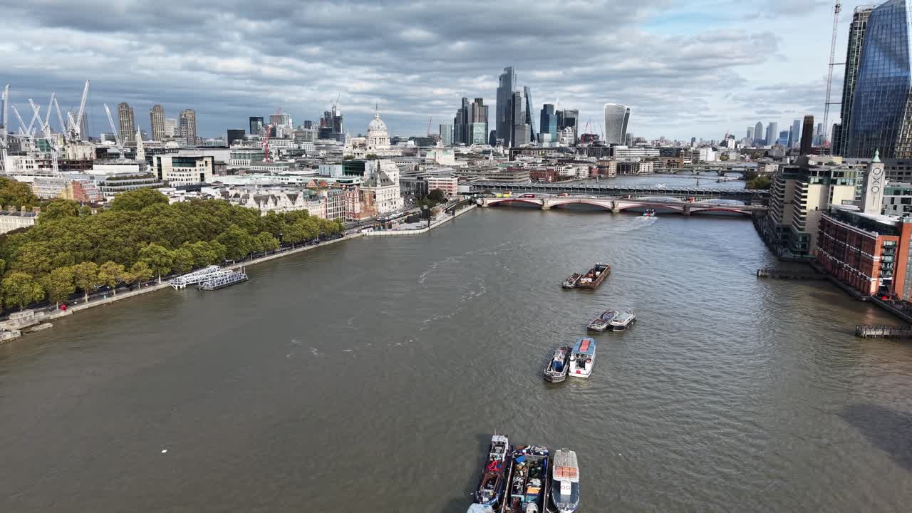 Barges moored on River Thames Central London UK drone,aerial