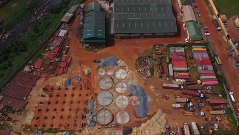 beautiful jib up of a large industrial zone with warehouses and buildings under construction in ibadan, nigeria on a sunny day