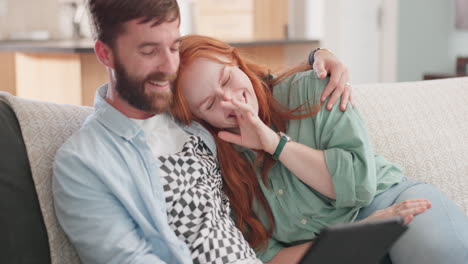 Young-couple,-tablet-and-laugh-on-sofa-with-social