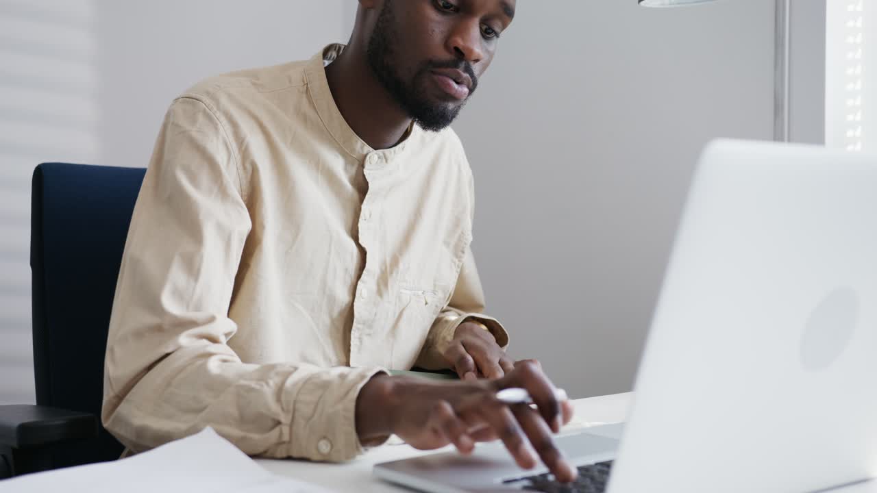 Man Working on Laptop in Office