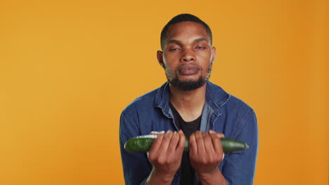 Confident-person-pretending-to-do-workout-exercises-with-a-cucumber