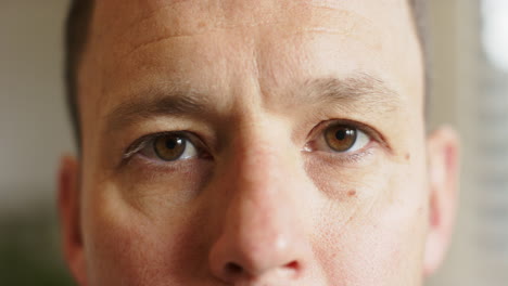 close-up of man's eyes, focusing on expression and detail in prosthetic lab