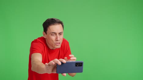 excited man having a video call and showing something shocking
