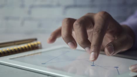 person analyzing data on a tablet