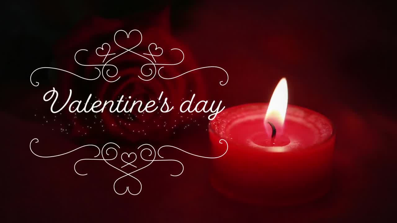 Animation of Valentine's Day written in white letters with a red candle in background