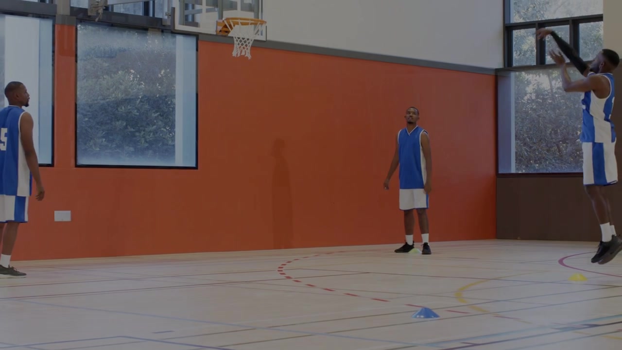 Right player releasing basketball teammates practicing drill causing overlaying sports court nodes