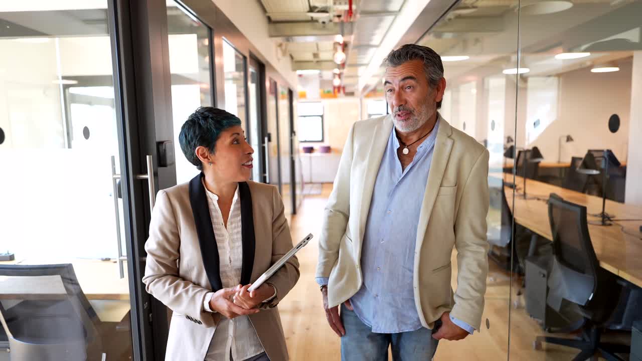 Business colleagues in an office hallway