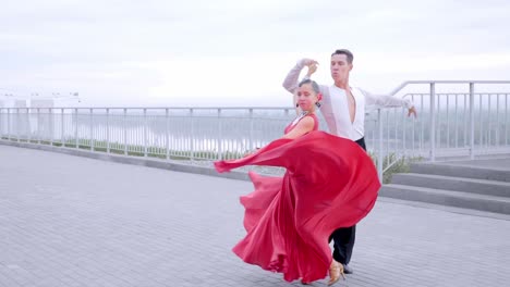 couple ballroom dancing outdoors