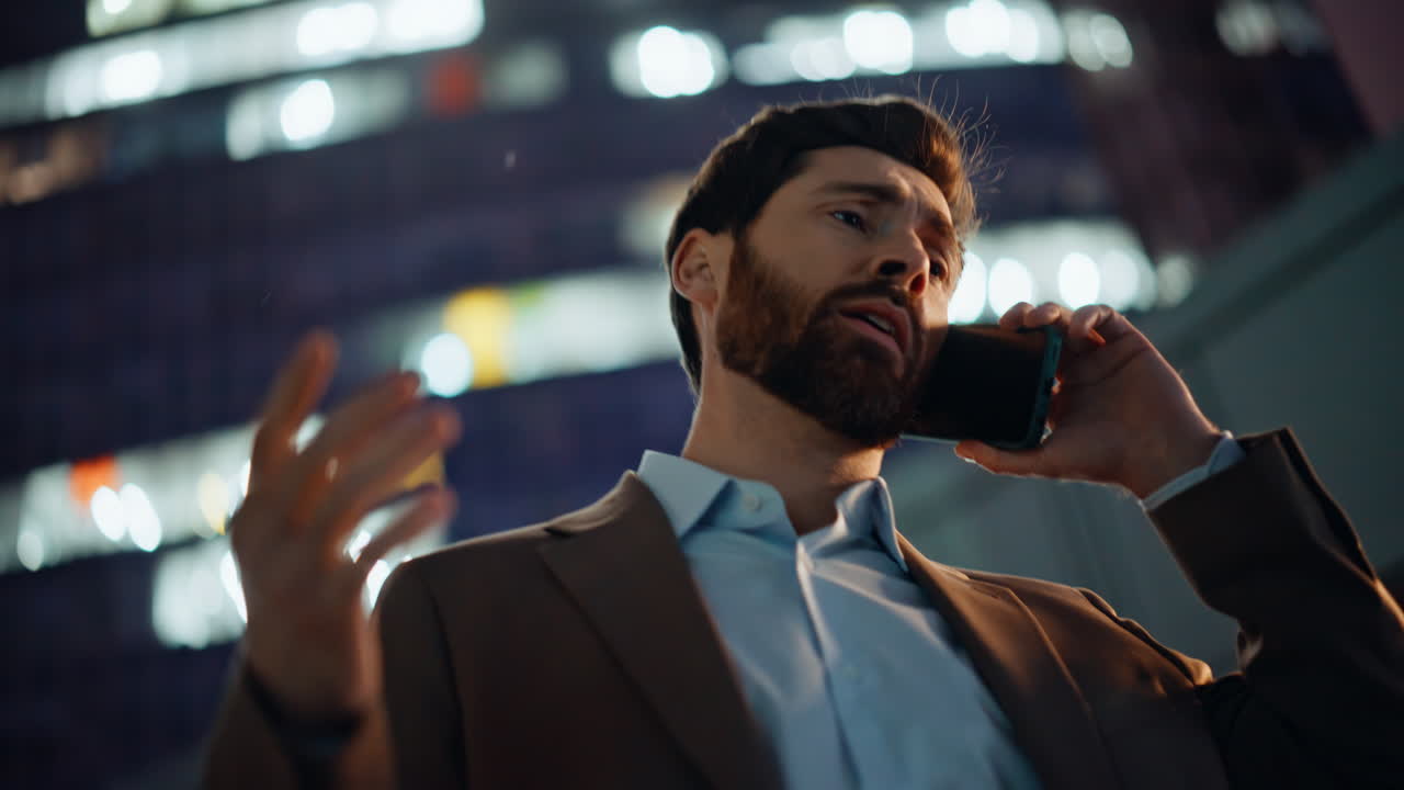 Worried manager smartphone conversation at night city portrait. Ceo talking