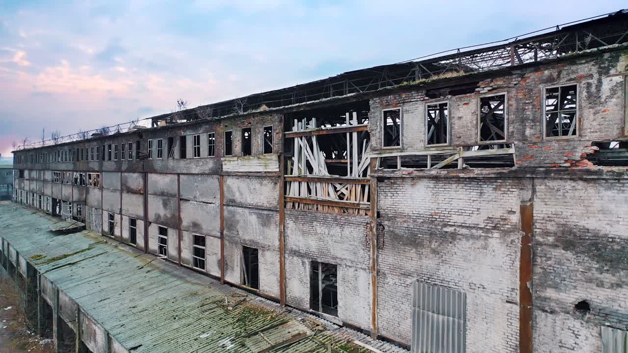 Aerial view from the air to an abandoned factory. Old industrial building for demolition.