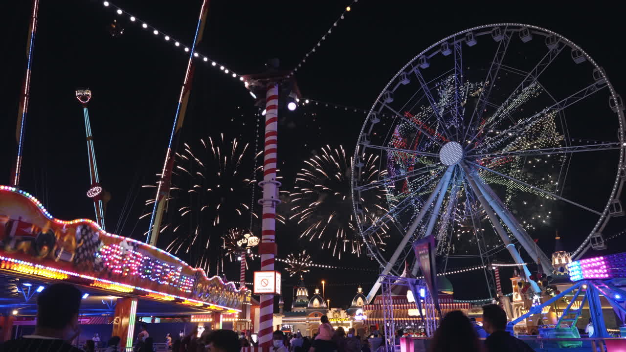 Nighttime Fireworks and Fun at Amusement Park
