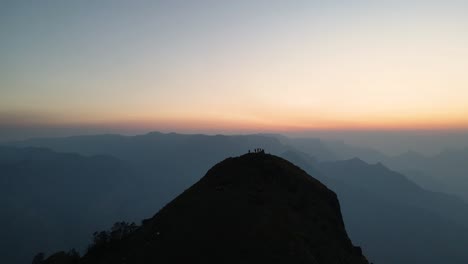 aerial drone shot of kolukkumalai range illuminated by the first rays of the morning sun