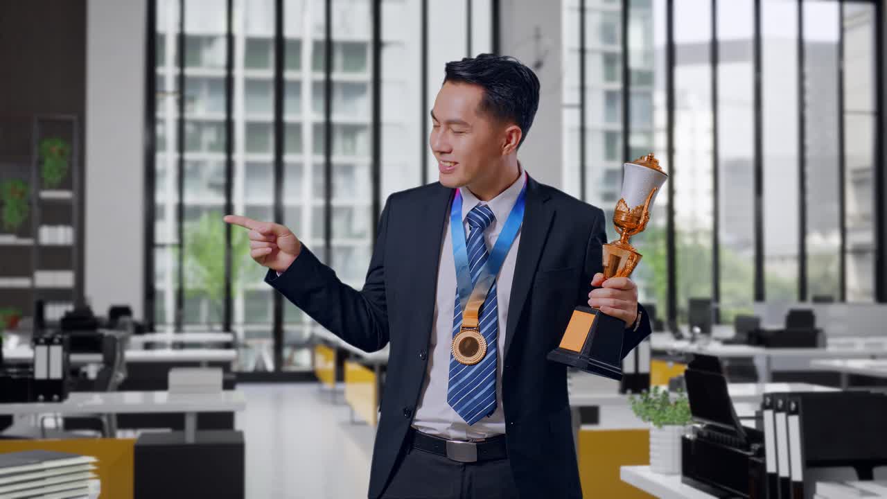 Businessman Celebrating an Award in Modern Office