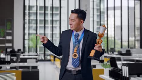 businessman celebrating an award in modern office