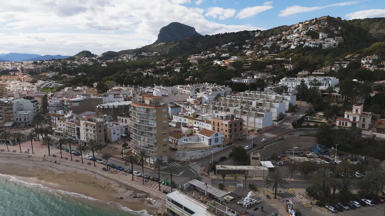 Smooth pass over marina reveals symmetrical lines of docked boats and clear water