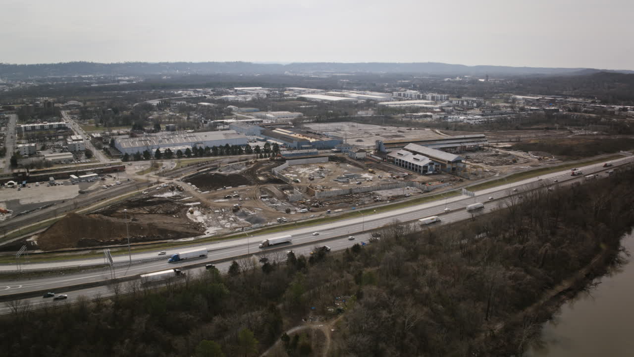 Aerial timelapse of construction of a baseball stadium rotating around the interstate 24 in Chattanooga, TN.