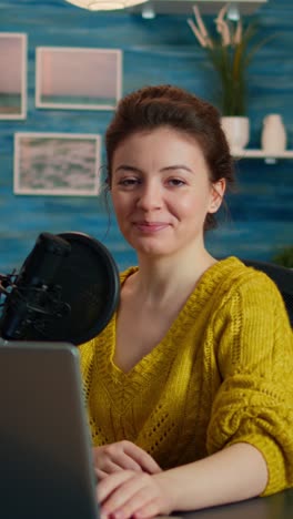 vertical video: portrait of vlogger looking at camera before starting live video vlog