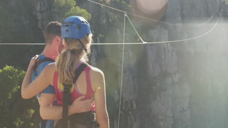 young caucasian couple in zip lining equipment