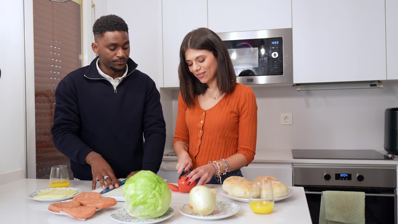 Couple Prepares Food in Modern Kitchen