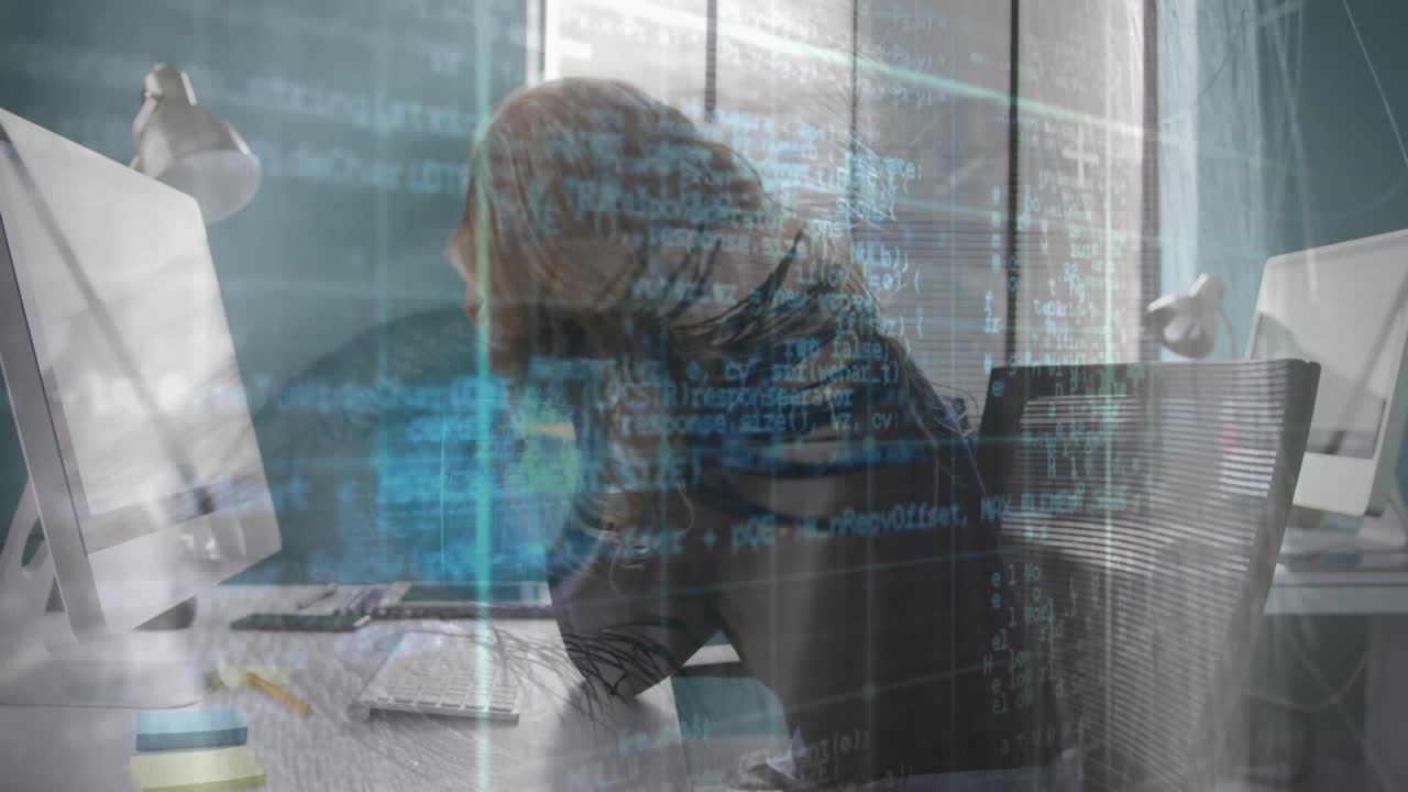Woman at desk typing and clicking mouse, initiating code overlay and leaning forward debugging task