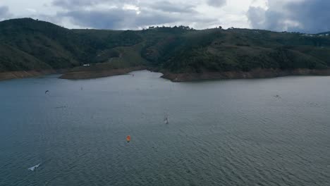 Aerial-Lake-Calima-at-Sunset-Flying-Over-Kiteboarders