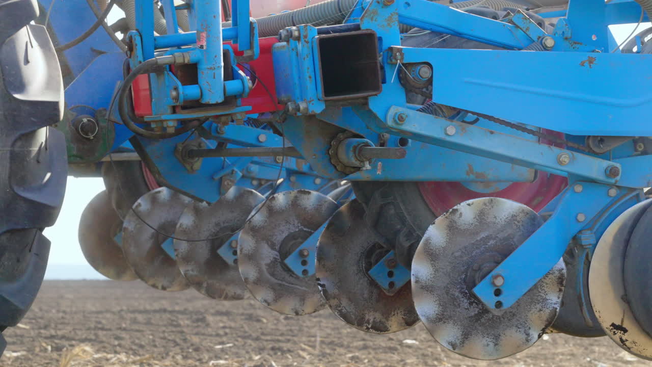 Tractor and Seeding Equipment in Field
