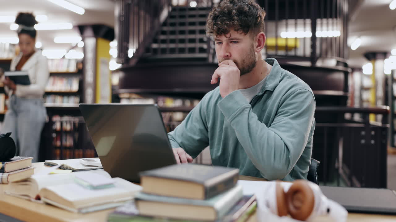 Young Man Studying in a Library