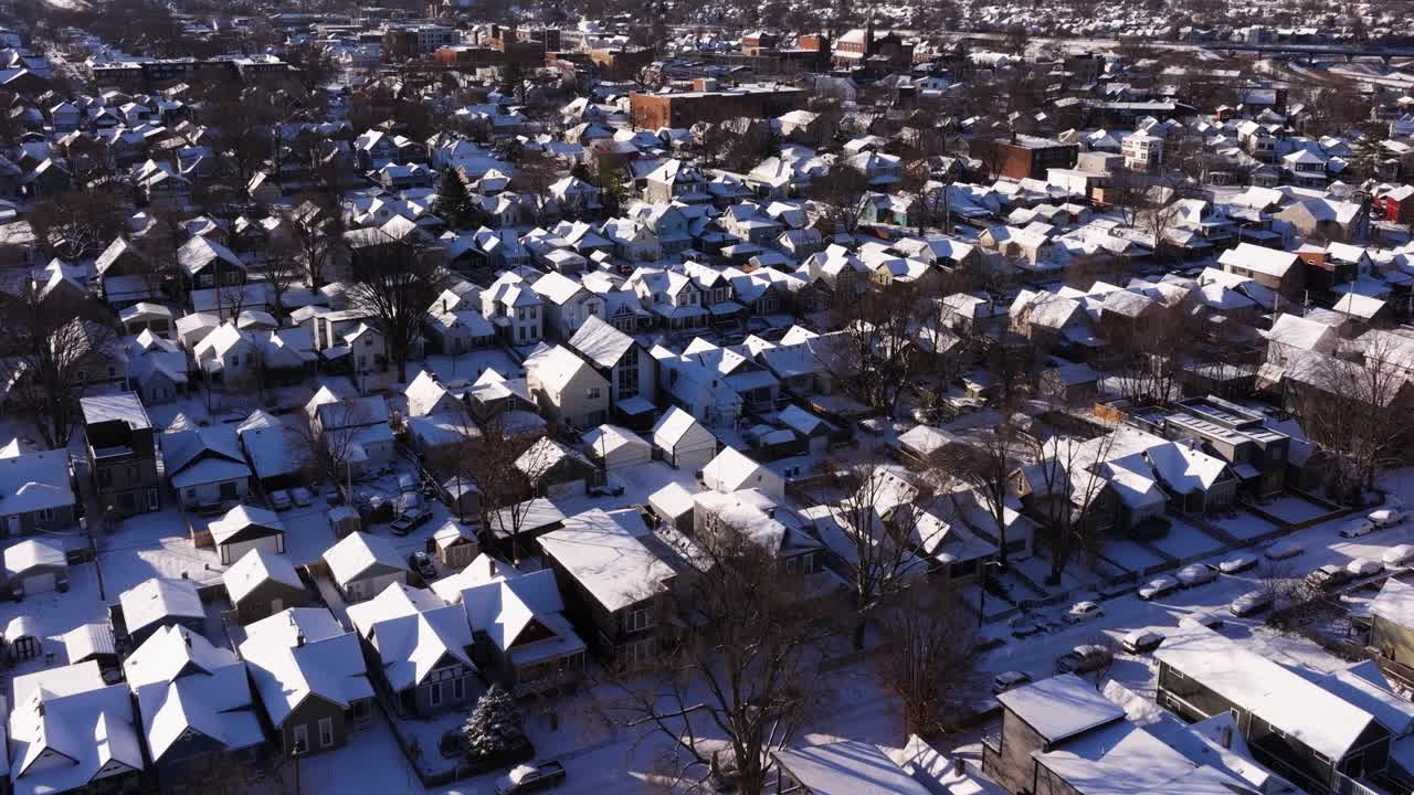 Amazing Drone Shot Above Snow Covered Houses in Urban Neighborhood. Cold Winter Day. USA