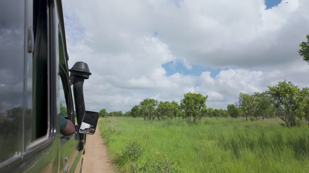 Safari Jeep Vehicle With Tourists In Mikumi National Park, Tanzania, East Africa. POV Shot