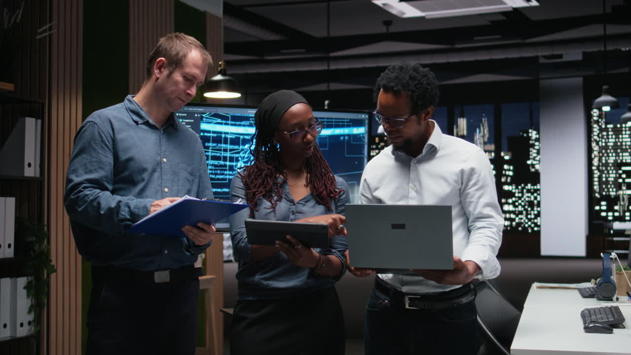 Diverse Business Team Collaborating in Modern Office at Night