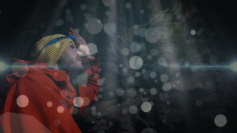 mountaineer adjusting headlamp inside cave, showing dust particles with animated tech overlays