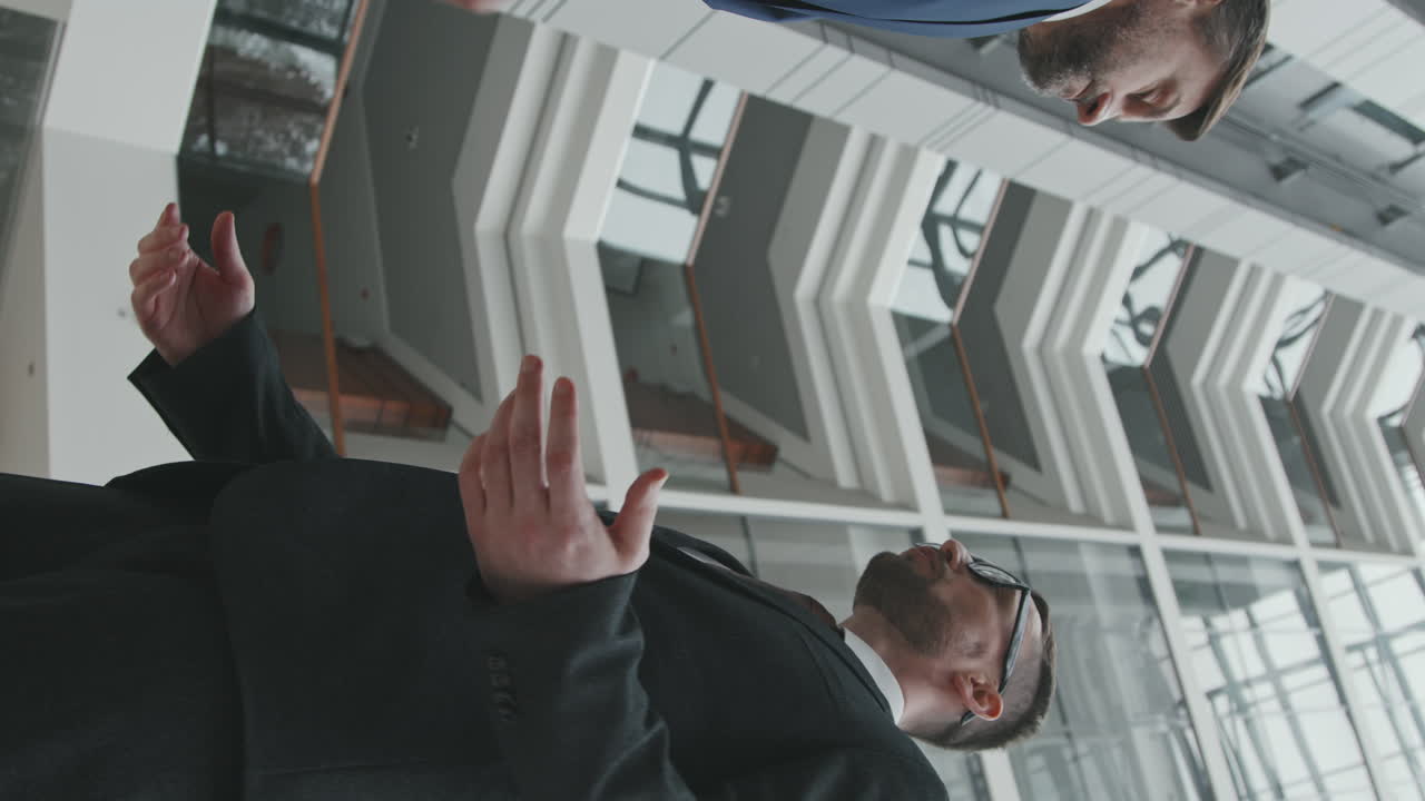 Vertical Shot of Businessman Shaking Hand to his Lawyer