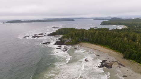 The-ocean-waves-crashing-on-the-beach-in-Tofino-BC,-a-surf-destination-in-British-Columbia-Canada