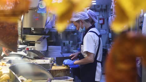 chef skillfully prepares roast duck in a kitchen