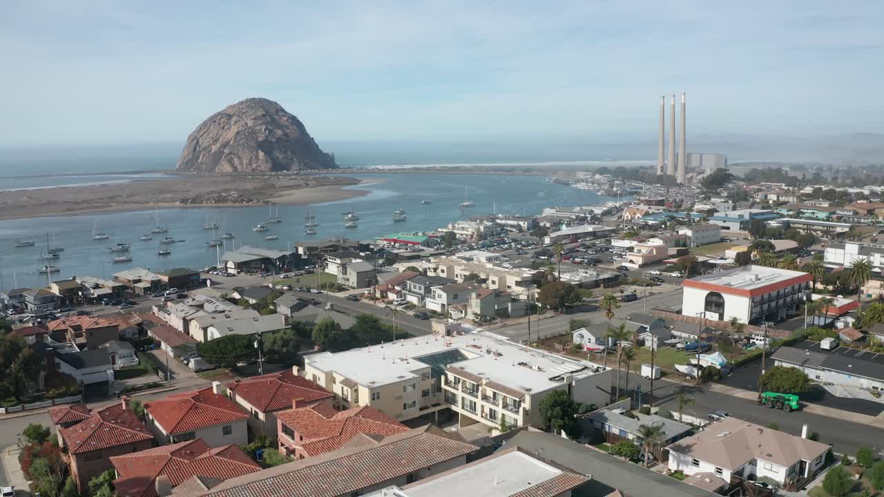 Aerial descending and panning shot of Morro Bay, California. 4K