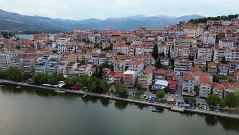aerial excursion over kastoria's lake and city in brilliant daylight splendor