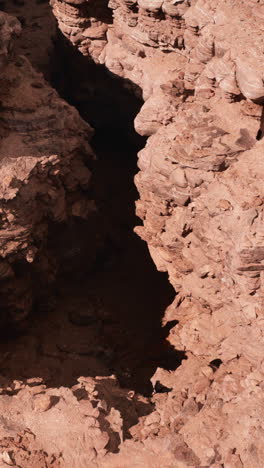 a close up view of a deep canyon in a desert