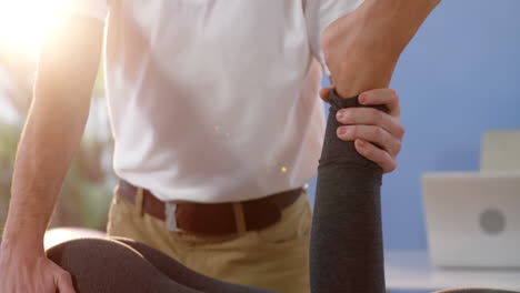 female patient receiving leg massage from male physiotherapist