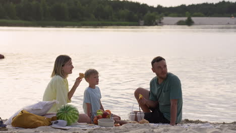 family having picnic on the beach