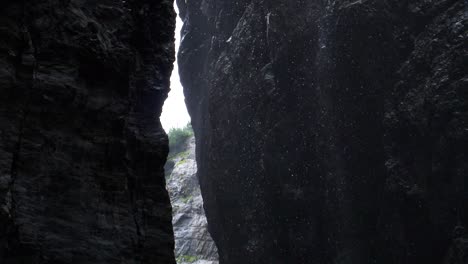 wild river inside glacier canyon slow motion of rain drops inside massive glacier canyon