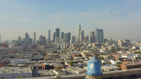 AERIAL:-Breathtaking-wide-shot-of-Downtown-Los-Angeles,-California-Skyline-in-beautiful-sunlight,blue-sky,