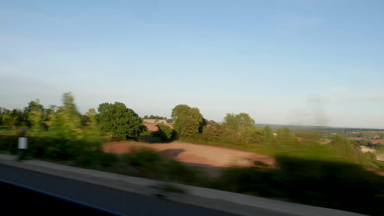 Shot of the Countryside from a Moving Car